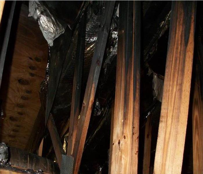 charred trusses in attic