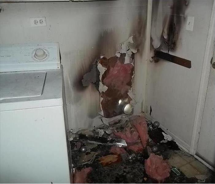 ruined wall, fire from vent in wall by dryer